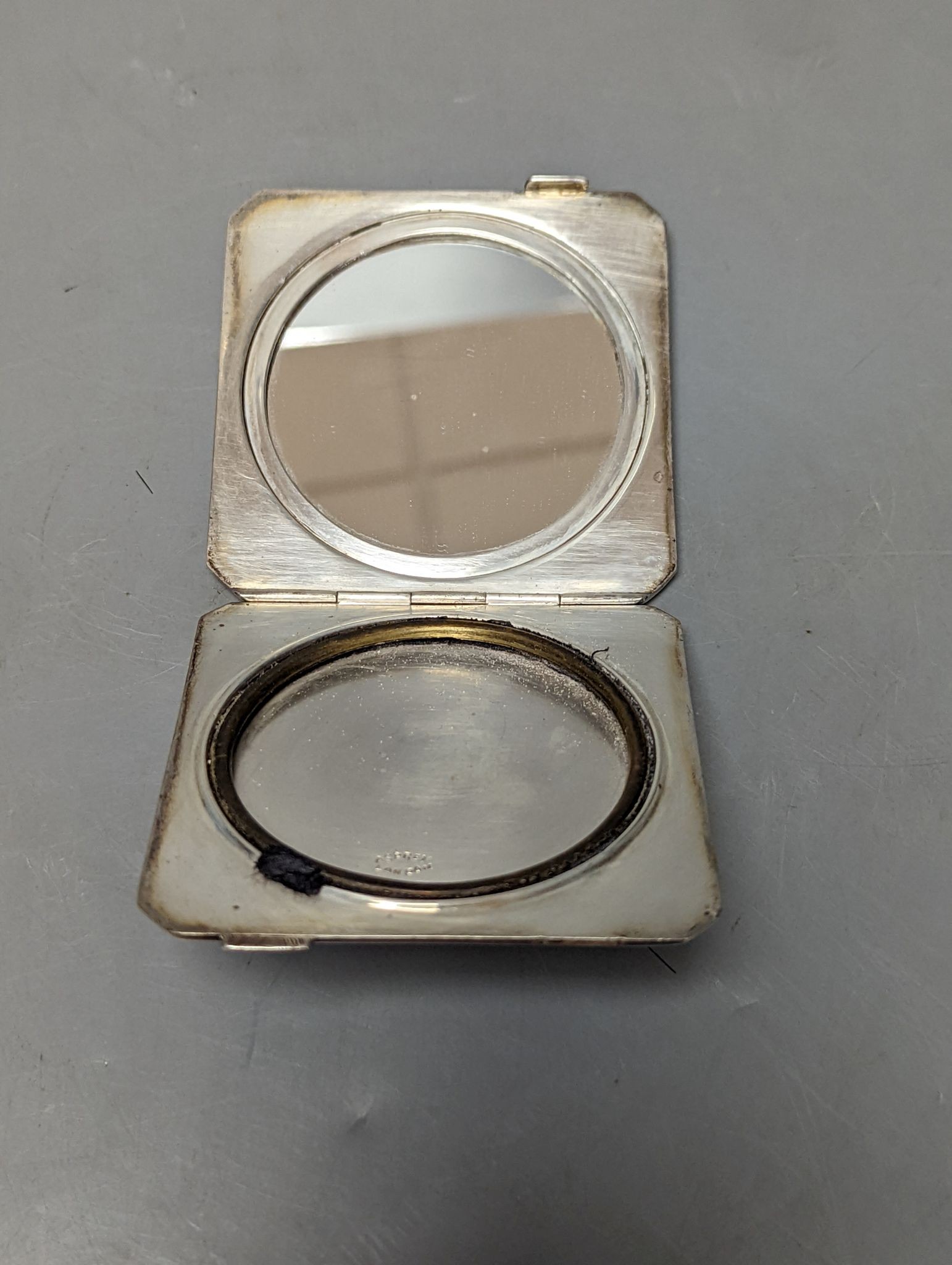 A 1930's At Deco Asprey & Co silver and blue guilloche enamel compact, 74mm.